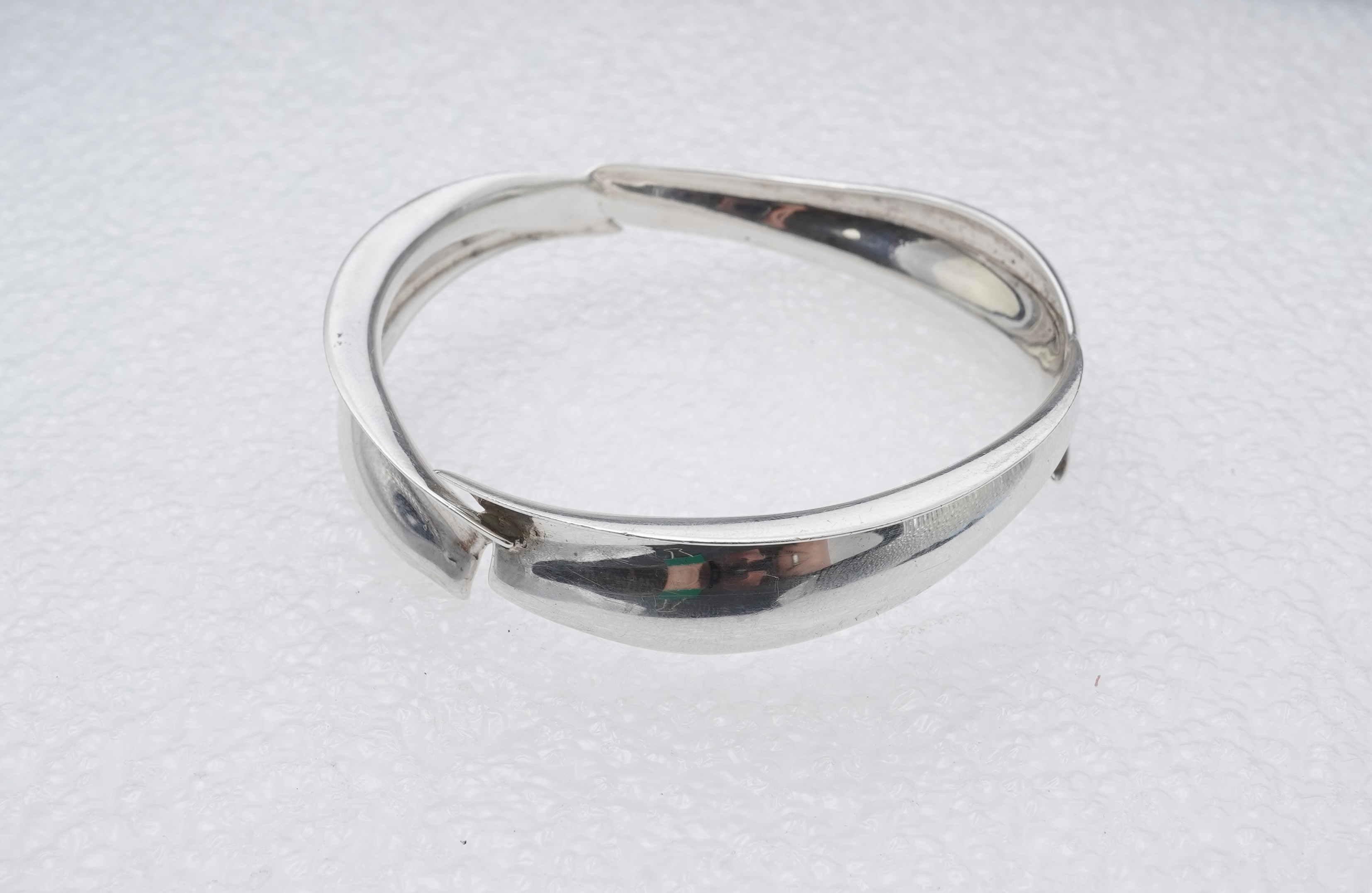 Frank Gehry for Tiffany & Co., a silver 'Fish' bangle, circa 2008